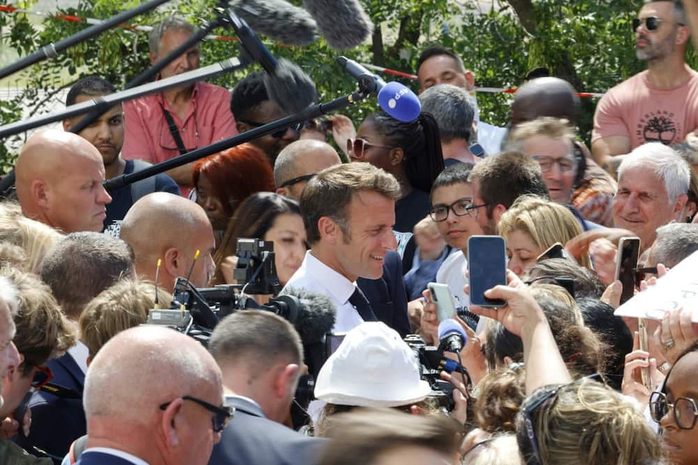 During a walkaboout in Marseille, Macron got into a discussion with a woman about her son's job prospects