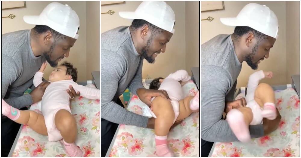 Guardian faces tough moments in his attempt to change his daughter's diaper.