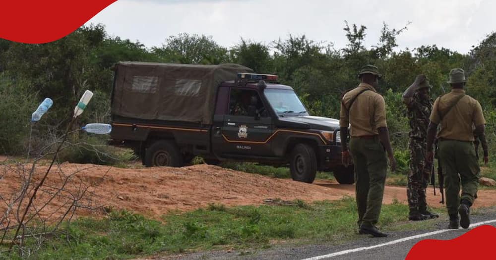 Police patrol a deserted road in Kwale