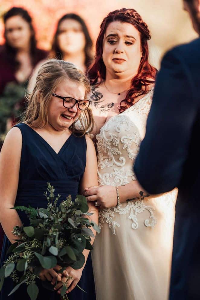 Tearful groom reads vows to step-daughter as he marries her mother in heartwarming photos