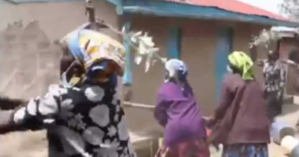 Women demolishing Esther Kipchumba's house. Photo: Screenshots/Baringo News.