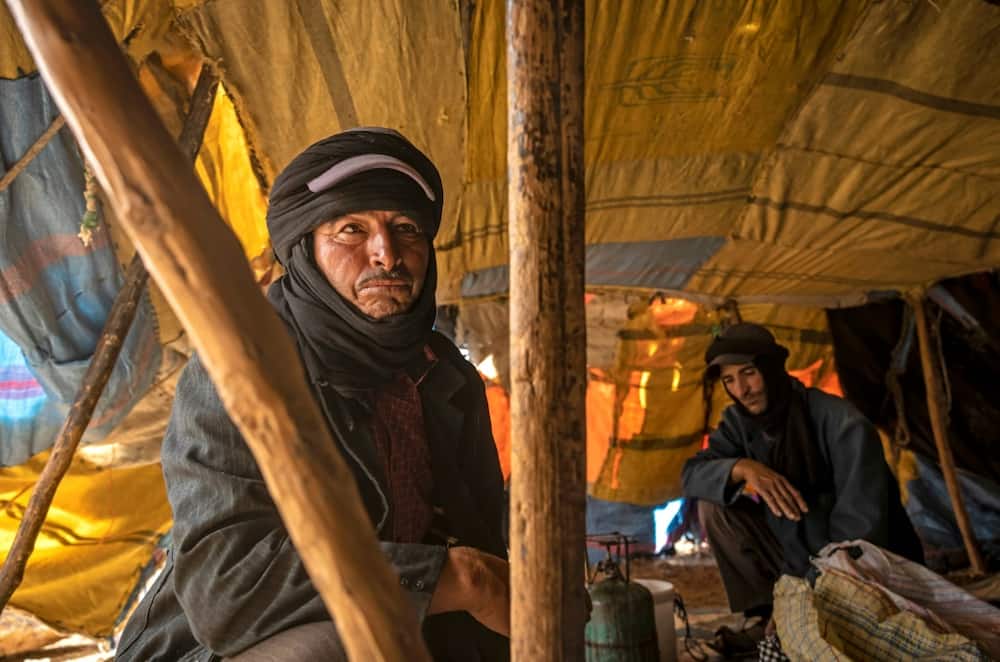 Amazigh man Moha Ouchaali sits in his tent near the village of Amellagou where Morocco's last nomads live