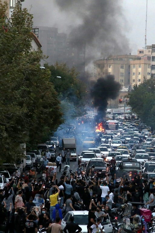 A picture obtained by AFP outside Iran on September 21, 2022, shows demonstrators taking to the streets of Tehran