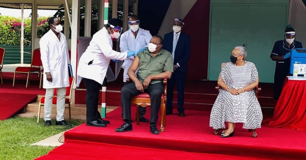 President Uhuru receiving COVID-19 jab. The government targets to vaccinate 26 million adults by June 2022. Photo: State House Kenya.