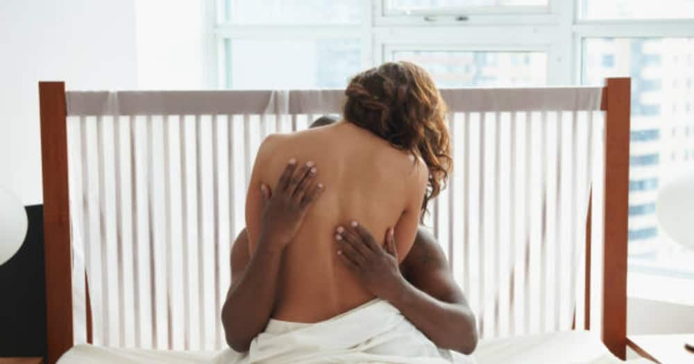 Man and a woman cuddling. Photo: Getty Images.