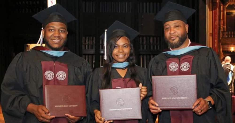They graduated the same day. Photo: The Associated Press.