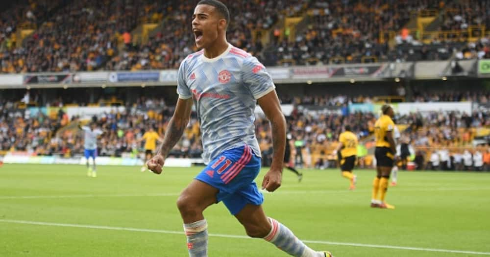 Mason Greenwood celebrates scoring the opening goal during Man United's vs Wolves at the Molineux stadium. Photo by Oli SCARFF.