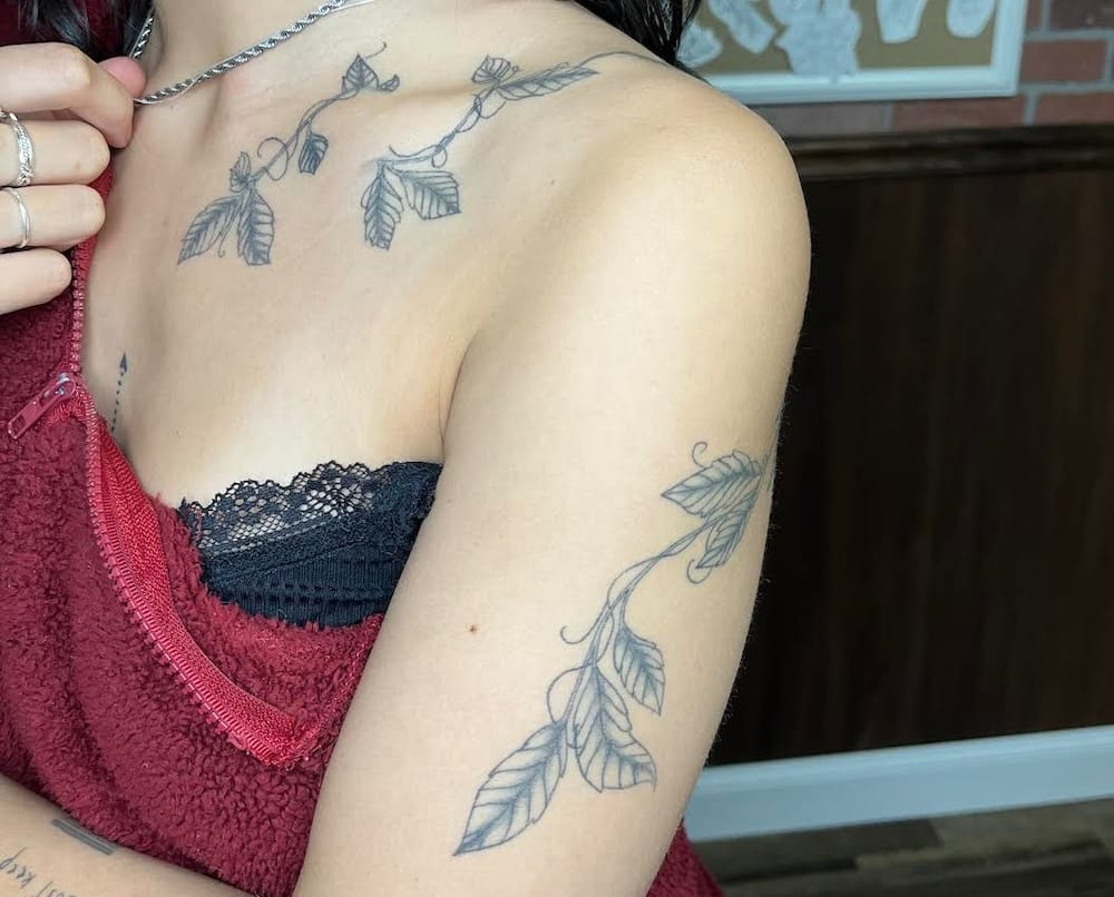 A model showcasing the vine shoulder and chest tattoo.