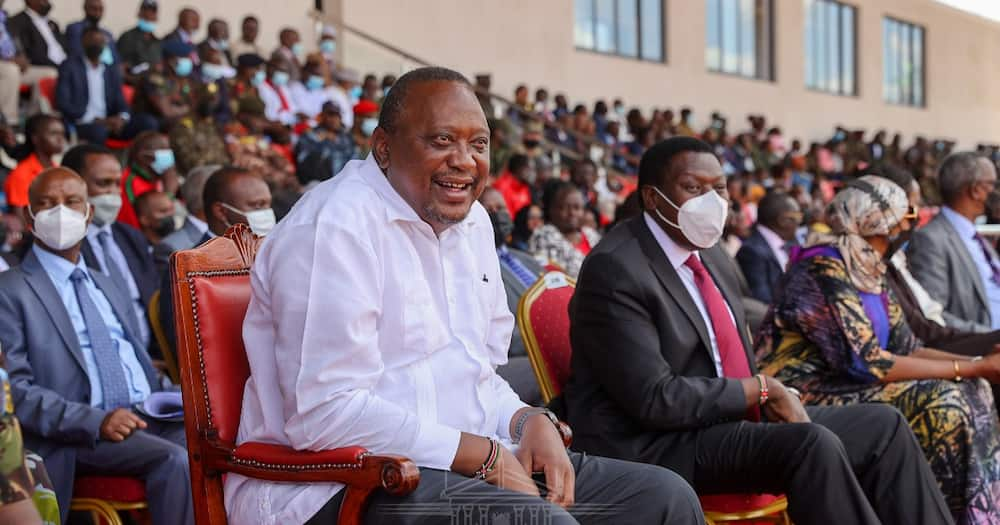 President Uhuru Kenyatta laughing.