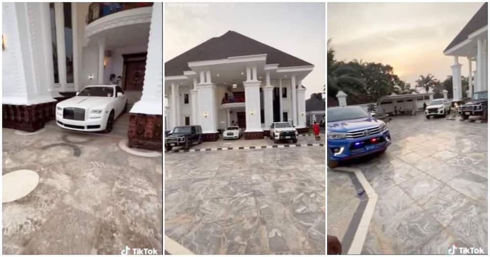 Mansion in Africa with luxury cars in the compound