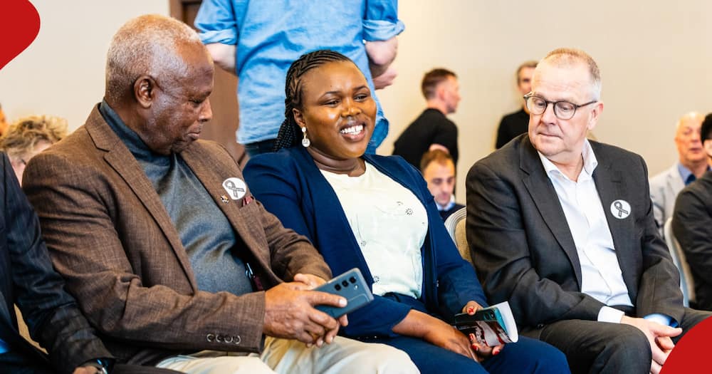 Kelvin Kiptum's wife, Asenath Rotich (c) all smiles as she converses with athletics bosses in Netherlands.