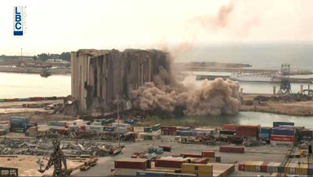 Parts of Beirut's blast-damaged grain silos collapsed on July 31, 2022, as seen in this screen grab of Lebanese Broadcasting Corp International footage