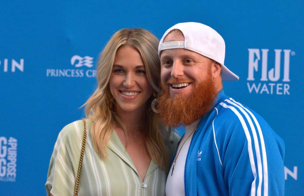 Justin Turner and wife Kourtney Turner after she sang the National News  Photo - Getty Images