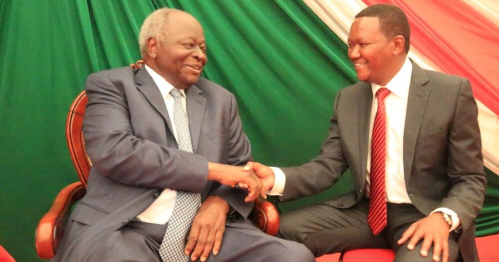 Alfred Mutua and late Mwai Kibaki at a past event.