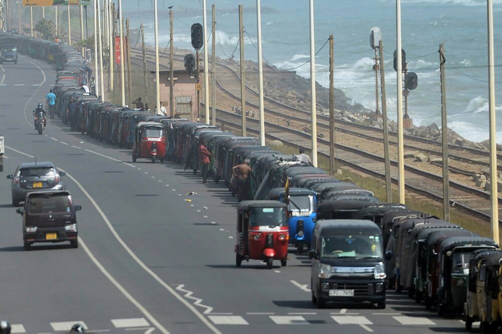 Emergency curfews, tear gas plumes and the sudden departure of the president have all failed to budge the long vehicle queues snaking out of Colombo's empty petrol station