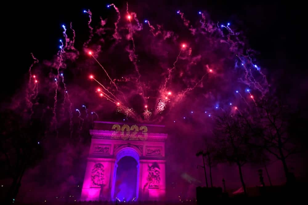 Fireworks explode over the Arc de Triomphe as France ushers in 2023