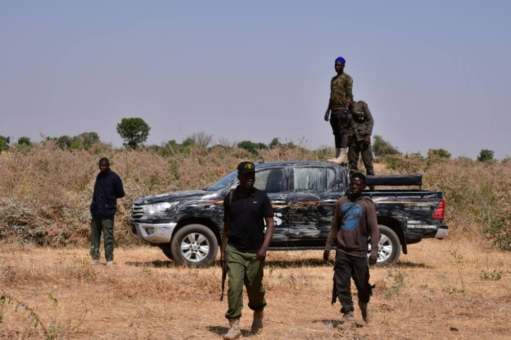 Nigerian security forces seen on the site of a sabotage attack allegedly perpetrated by Boko Haram on the outskirts of Maiduguri on February 12, 2021.