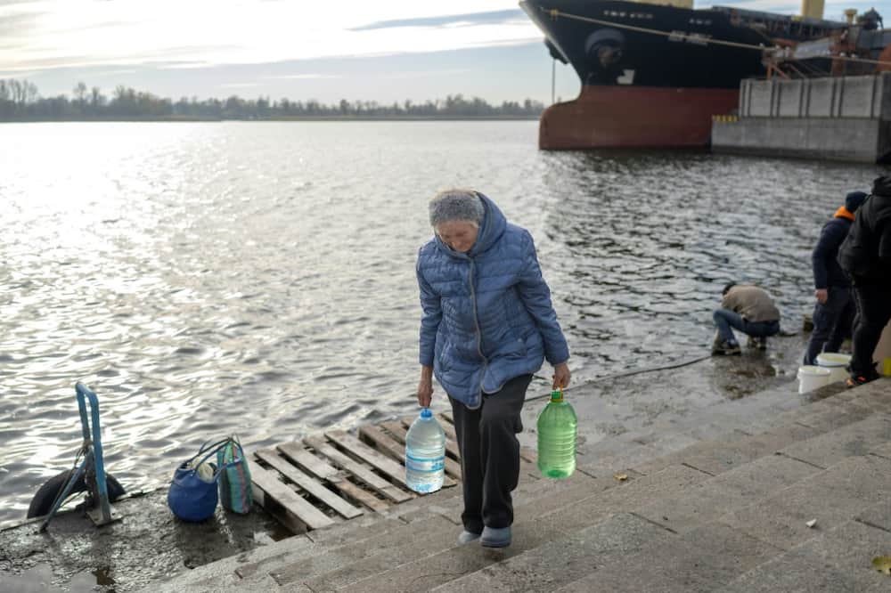 Local people are collecting water from the Dnipro river in Kherson,
now a natural dividing line between Ukraine's forces and Russians on the opposing bank