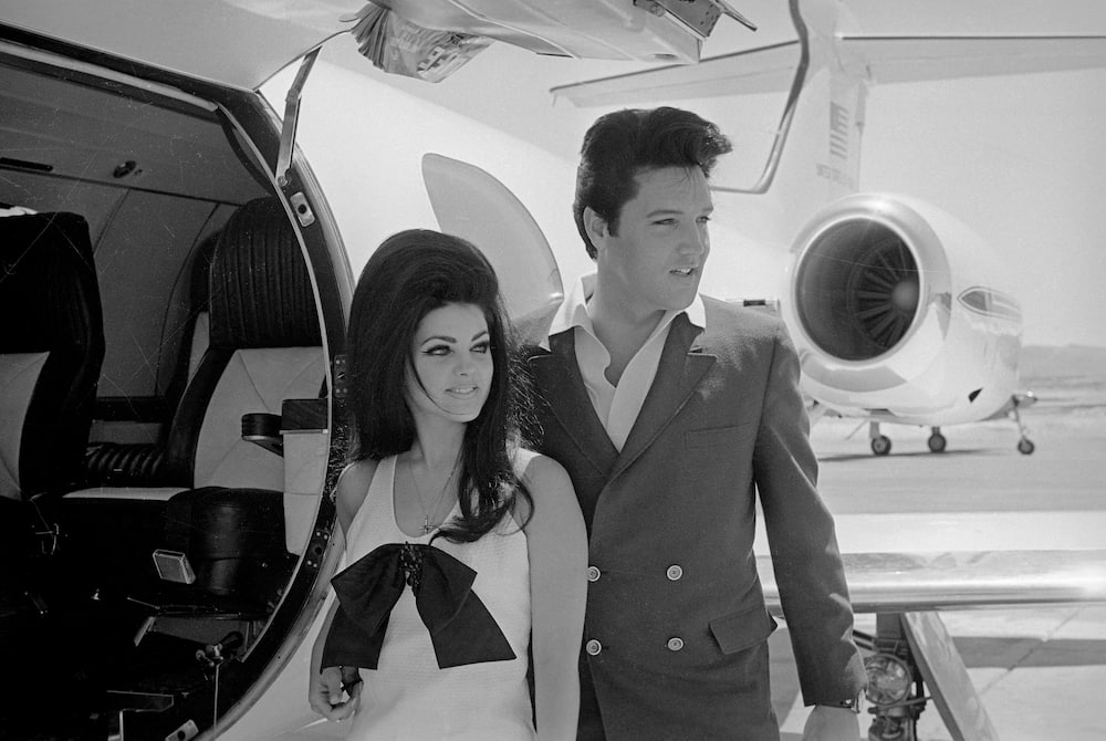 Elvis and Priscilla Presley prepare to board their private jet following their wedding at the Aladdin Resort