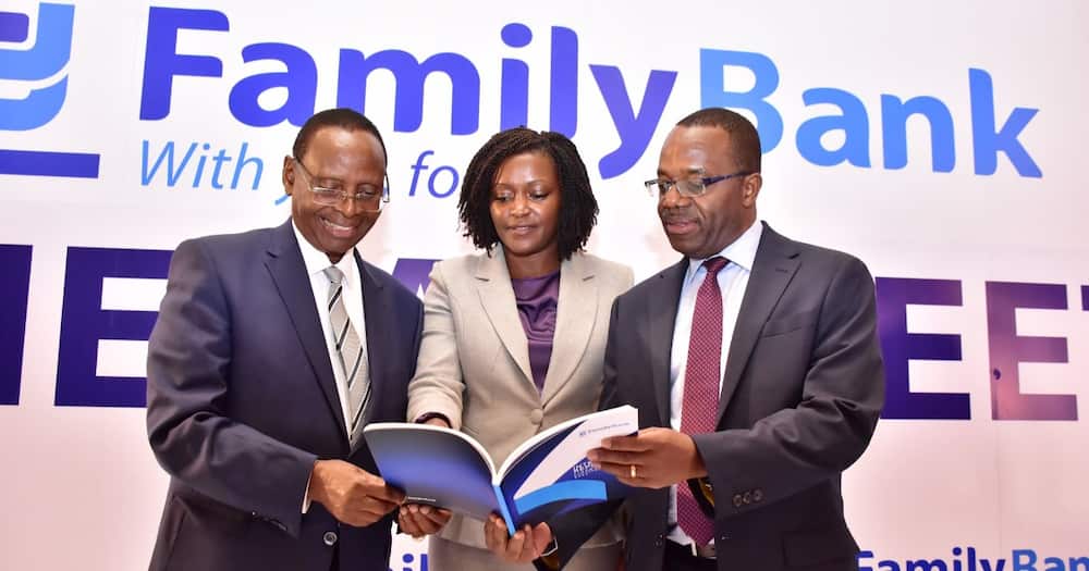 Family Bank officials look at the financial results in May 2022.