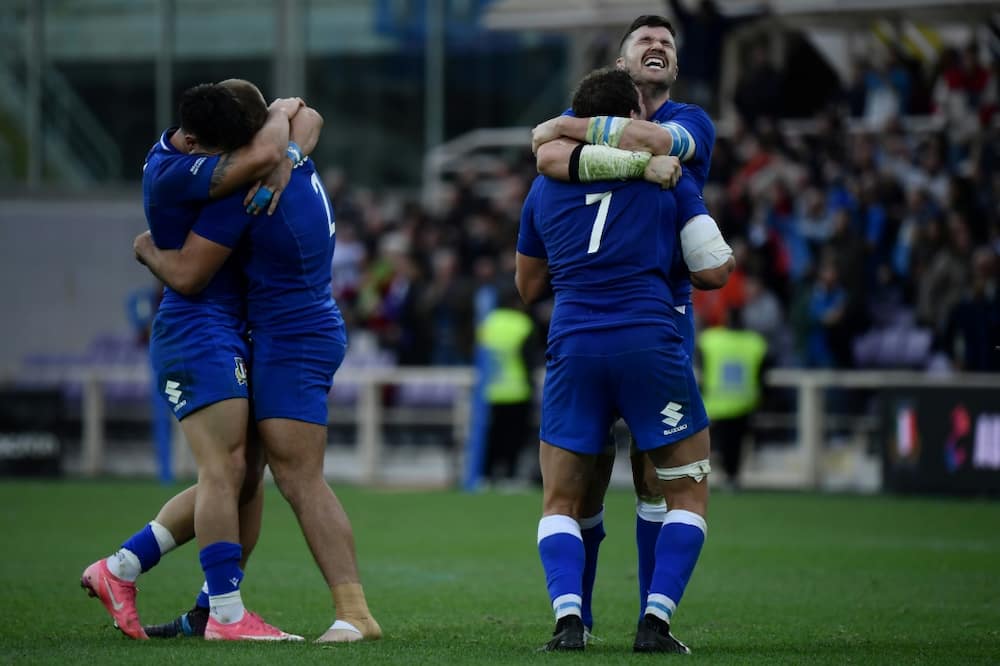 Italy's players celebrate their first victory over Australia