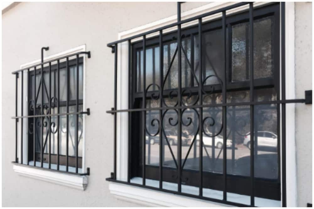 Wall-mounted metal window grill design