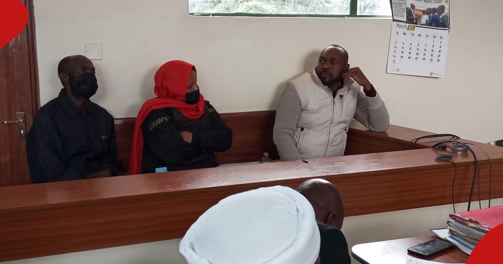 Samuel Ndung'u with two other murder suspects in the dock.