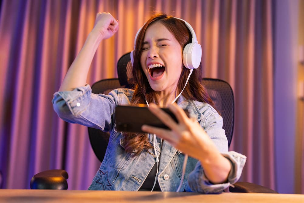 A woman is playing a video game