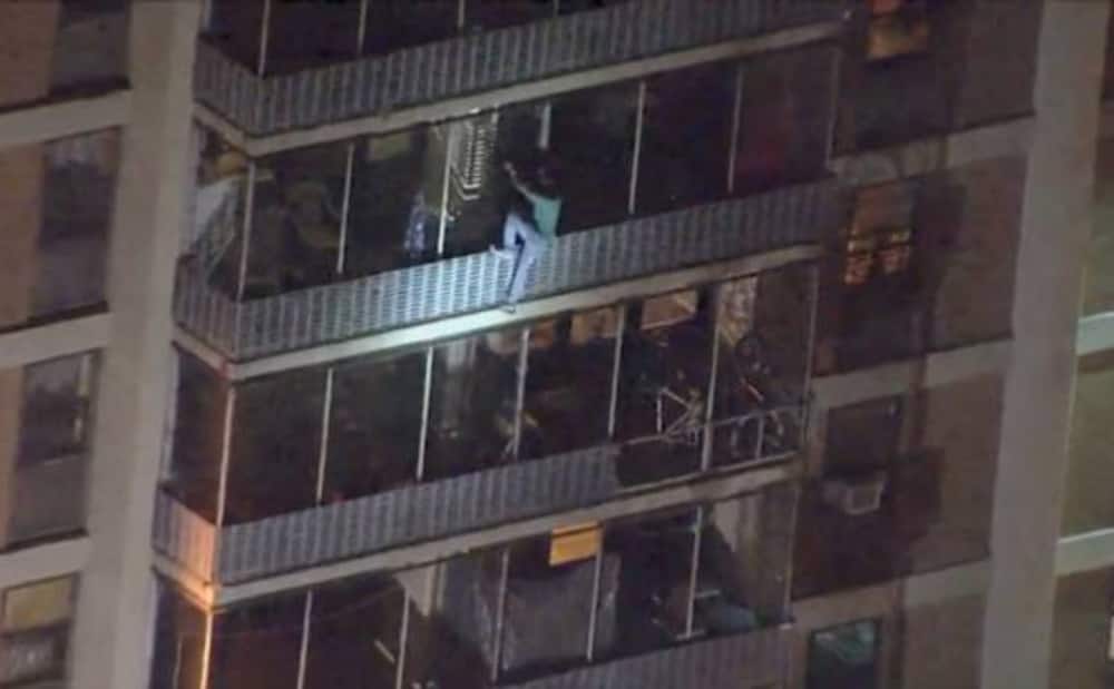 Man climbs 19-storey building in attempt to save bedridden mother from fire