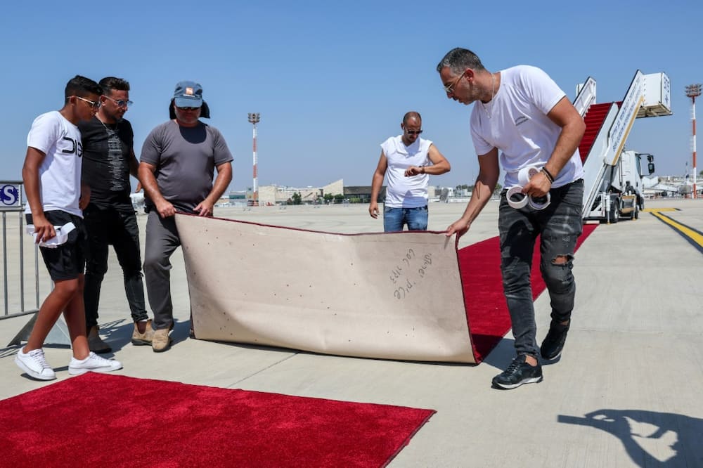 US President Joe Biden lands at Israel's Ben Gurion Airport on Wednesday, and workers have been laying the red carpet readying for his visit