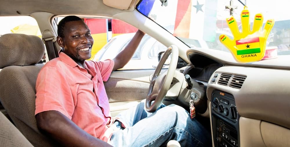 Ghanaian driver looking happy.