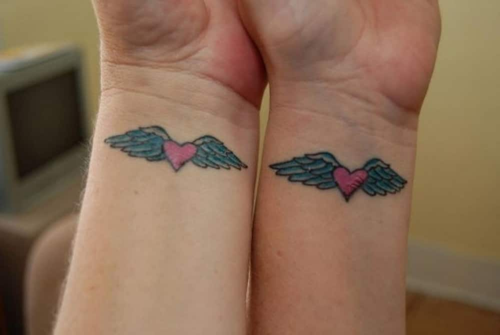 simple heart with wings tattoo designs