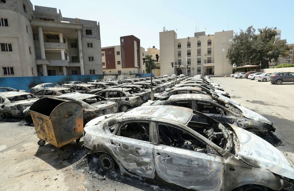 Burnt cars in Libya's capital Tripoli seen after clashes last month between backers of rival governments killed at least 32 people