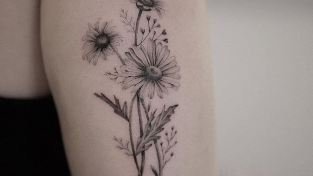 Wildflower and daisy tattoo