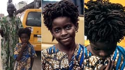 Photographer Captures Handsome Black Boy with Stunning Features Walking with Blind Father on Road