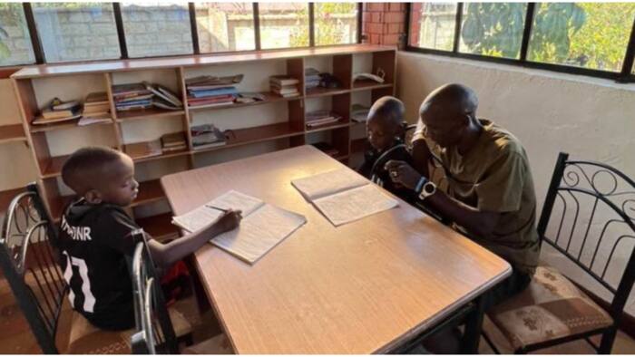 Proud Dad: Eliud Kipchoge Adorably Bonds With His Two Kids, Helps Them With School Work