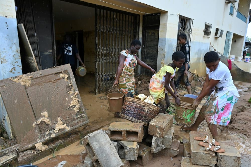 In Bingerville, residents cleared out their homes after the water finally receded