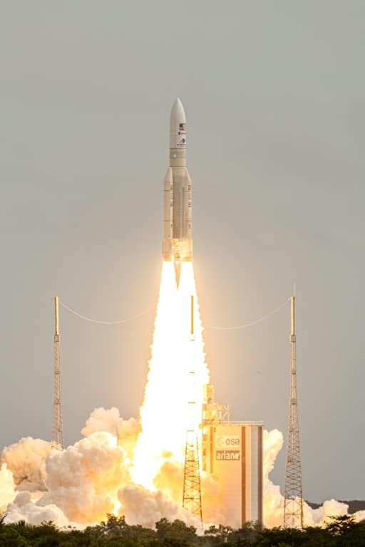 The European Space Agency's JUICE probe blasts into space on  April 14, 2023 aboard an Ariane 5 rocket from Europe's spaceport in Kourou, French Guiana, on a mission to explore Jupiter's icy moons