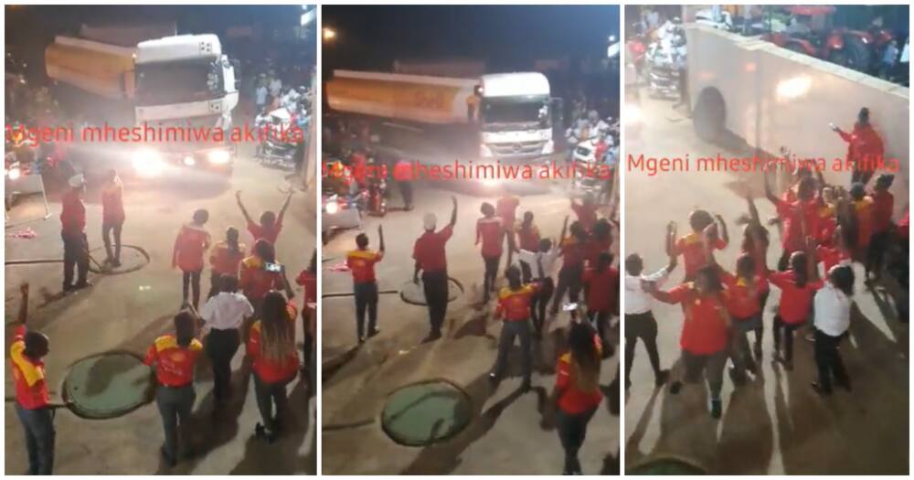 Petrol attendants cheers as fuel tanker arrives at station after fuel crises.