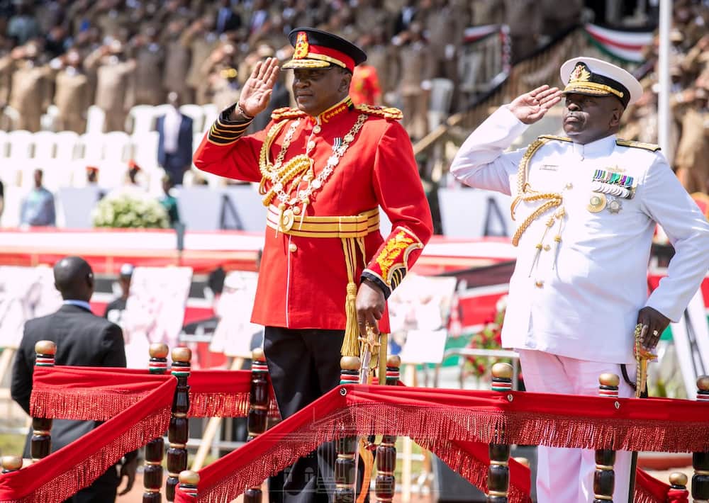 Uhuru gives First Lady Margaret Kenyatta military salute during Jamhuri Day celebrations