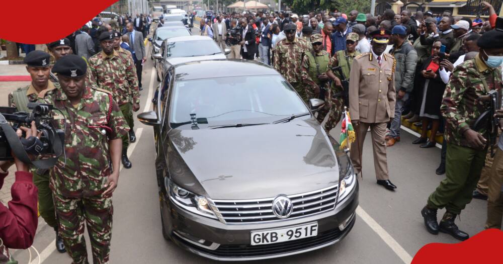 Police officers escort the car carrying Cabinet Secretary for national treasury and economic planning Prof. Njunguna Ndung'u.