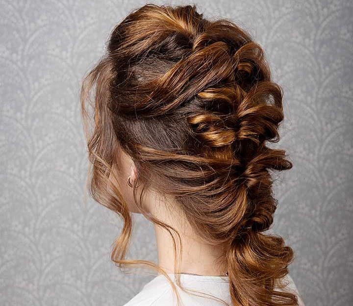 Side shot of a woman with french braid