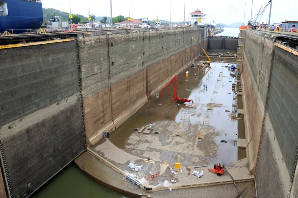 While work goes on in this chamber of the Panama Canal's Pedro Miguel locks, ships can still pass through the other chamber