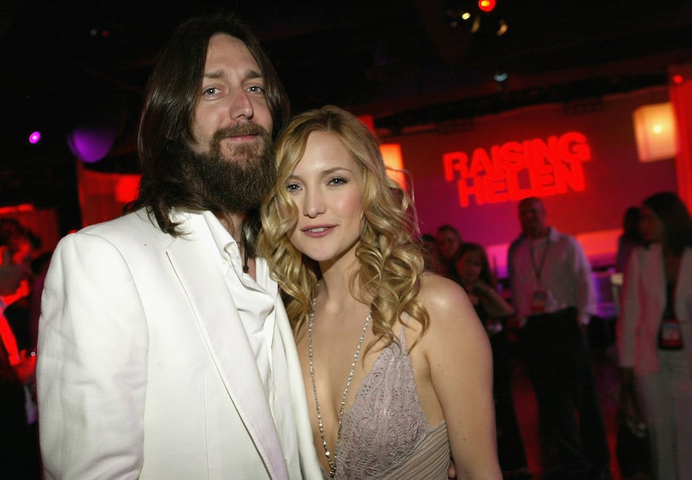 Actress Kate Hudson and then husband, musician Chris Robinson, pose as they attend the film premiere after party for the romantic comedy "Raising Helen" in 2004