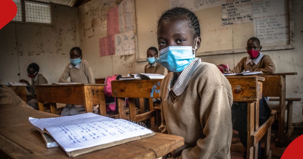 Primary school girl in Kenya in surgical mask.