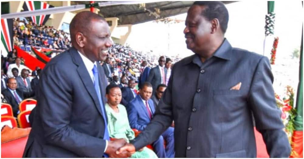 Raila Odinga and William Ruto shake hands.