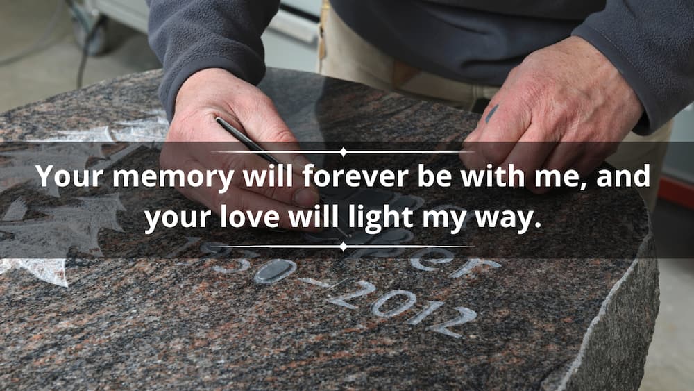 A person is writing on the gravestone
