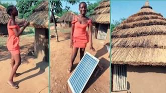 Black Lady Living in Thatched House Installs Solar Panel: "This Is Africa"