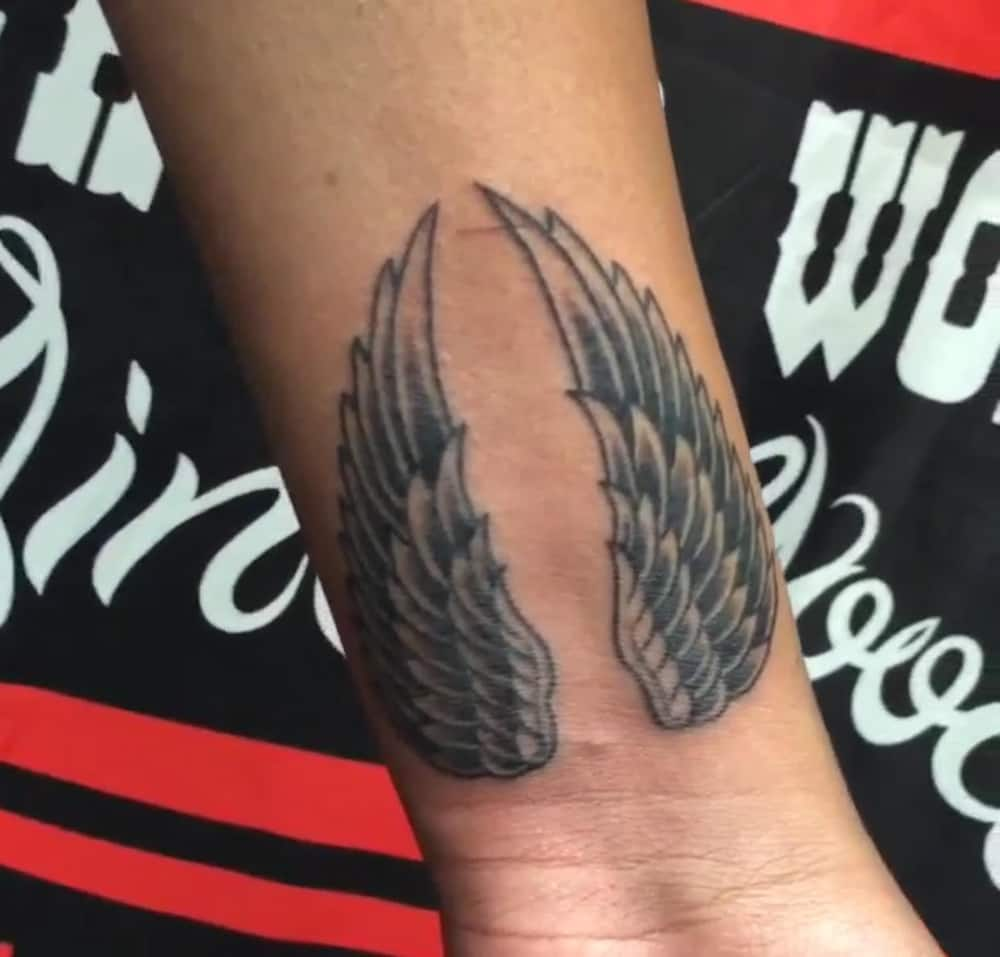 realistic angel wings tattoo