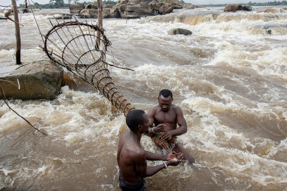 Fishing with a traditional net at the Wagenya falls